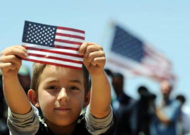 114118944-boys-shows-a-us-flag-as-president-barack-obama-speaks.jpg.CROP.promo-mediumlarge